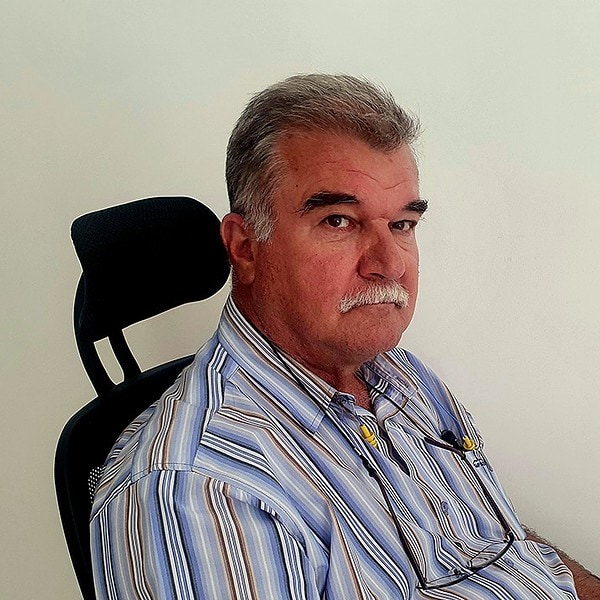 Romatex general manager of operations, Helmut Hock, sitting at his desk